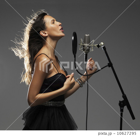 Studio shot of singing rockstar 10627295