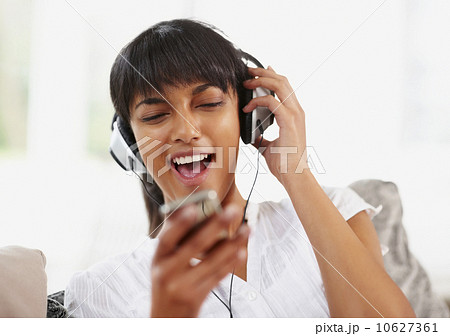 Young woman listening to music 10627361