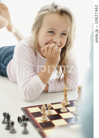 Girl (10-11) playing chess 10627462