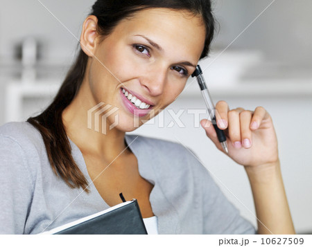 Woman writing in notebook 10627509