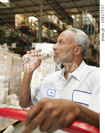 Warehouse worker drinking water Warehouse worker drinking water 10627537