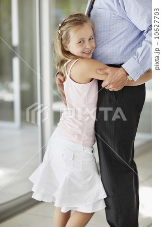 Granddaughter (10-11) hugging grandfather Granddaughter (10-11) hugging grandfather 10627703