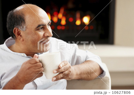 Man relaxing in living room Man relaxing in living room 10627806