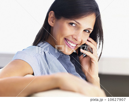 Woman talking on cellular phone Woman talking on cellular phone 10627907