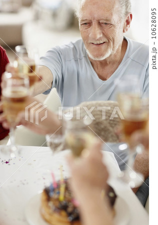 Senior man toasting with a glass of champagne 10628095