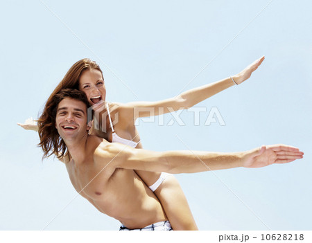 Young attractive couple enjoying summer holiday on beach 10628218