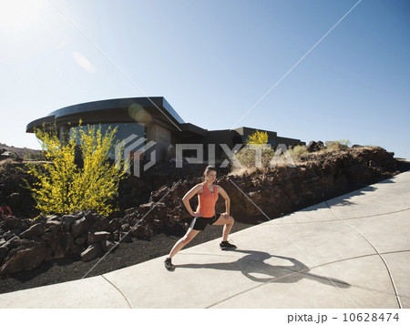 Young woman stretching Young woman stretching 10628474