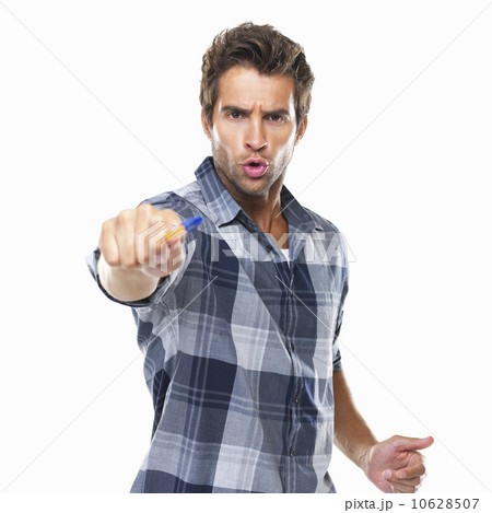 Studio shot of young confident man pointing with pen at camera Studio shot of young confident man pointing with pen at camera 10628507