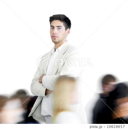 One person standing amongst a blur of other people 10628657