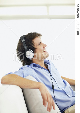 Man listening to music on headphones Man listening to music on headphones 10629035