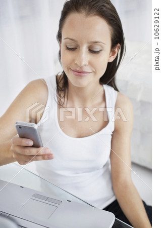 Pretty woman texting 10629122