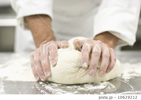 Baker kneading bread dough Baker kneading bread dough 10629212