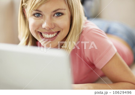 Portrait of young blonde woman using laptop Portrait of young blonde woman using laptop 10629496