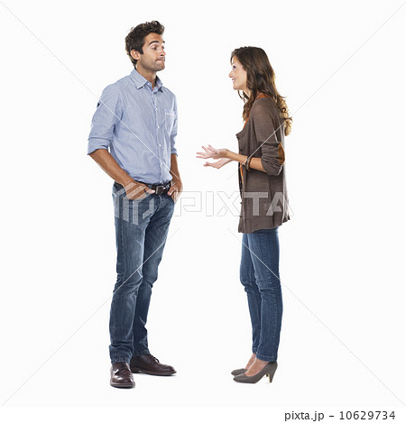 Studio shot of young couple having conversation Studio shot of young couple having conversation 10629734