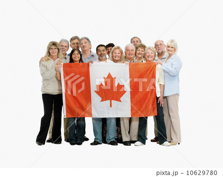 Group of people holding a Canadian flag 10629780