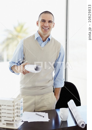 Architect working in office 10629833