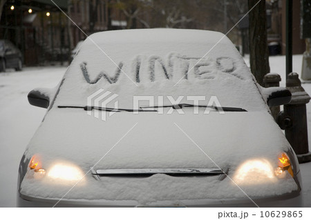 Parked car covered in snow Parked car covered in snow 10629865