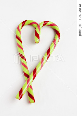 Peppermint candy canes in heart shape, studio shot 10630038