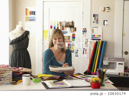 USA, Texas, Dallas, Portrait of female fashion designer working in studio 10630174
