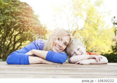 Portrait of mother and son (2-3) leaning at picnic table Portrait of mother and son (2-3) leaning at picnic table 10630222