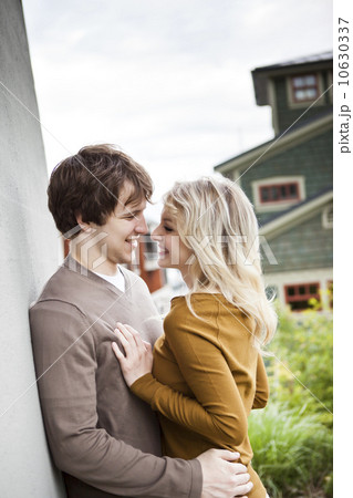 Young couple embracing, face to face 10630337