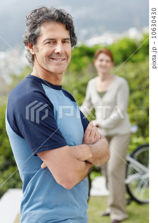 Handsome man standing with his arms crossed Handsome man standing with his arms crossed 10630430