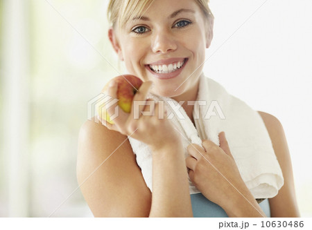 Portrait of young blonde woman holding apple Portrait of young blonde woman holding apple 10630486