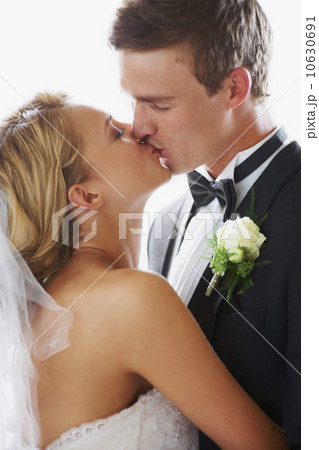 Bride and groom kissing Bride and groom kissing 10630691