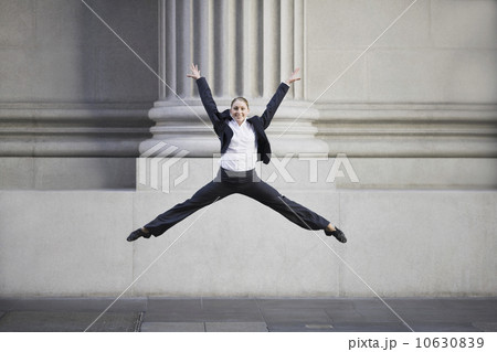 Businesswoman dancing in urban setting Businesswoman dancing in urban setting 10630839