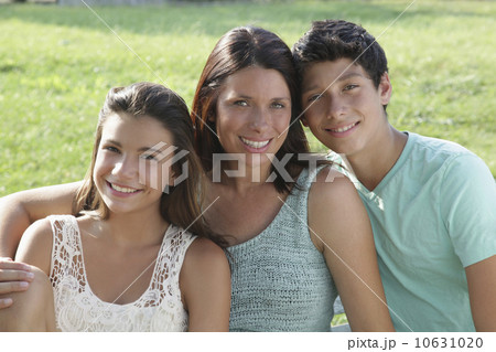 Portrait of mother with daughter (12-13) and son (14-15) 10631020