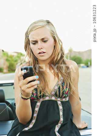 Woman leaning on car Woman leaning on car 10631223