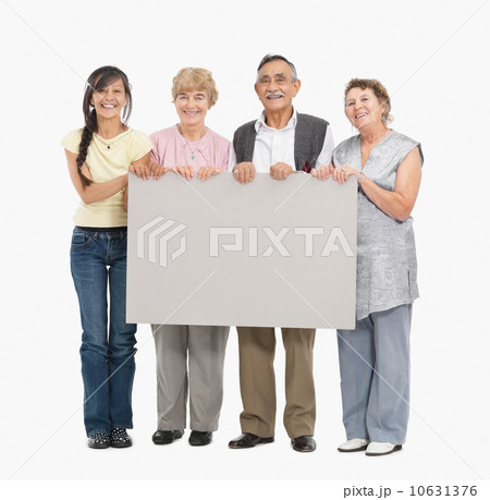 Four people holding a blank poster 10631376