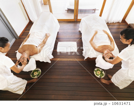 Couple getting massage in spa Couple getting massage in spa 10631471