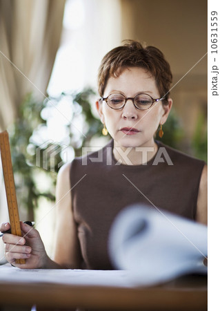 Architect working in studio 10631559