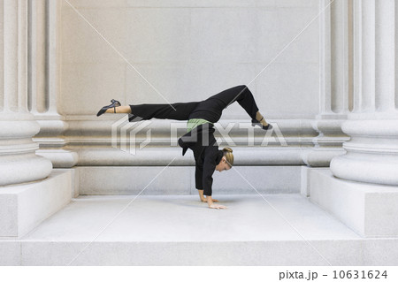 Businesswoman dancing in urban setting Businesswoman dancing in urban setting 10631624