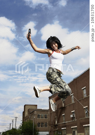 Teenage girl jumping in the air 10631700