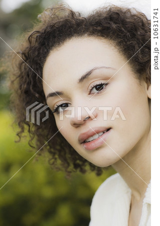 Portrait of young woman smiling, outdoors Portrait of young woman smiling, outdoors 10631741