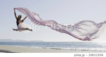 Dancer leaping on beach Dancer leaping on beach 10631936