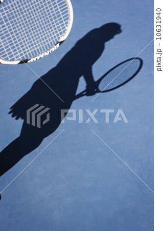Shadow of female tennis player  10631940