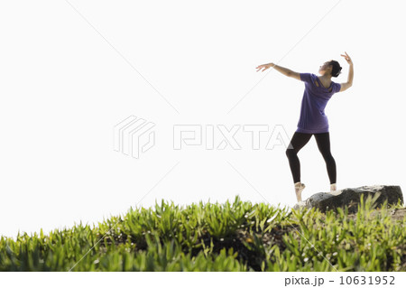 A woman dancing outdoors 10631952