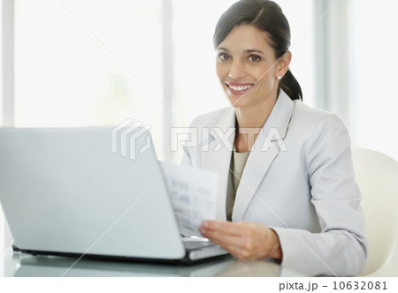 Businesswoman working on laptop 10632081