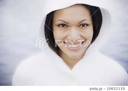 Portrait of woman smiling by sea 10632139