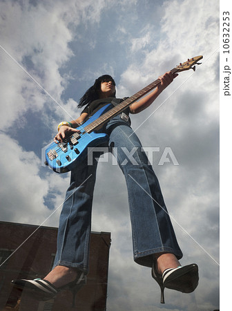 Guitar player suspended in the air Guitar player suspended in the air 10632253