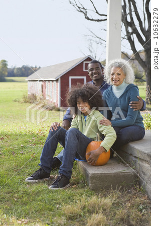 Family sitting on porch Family sitting on porch 10632279