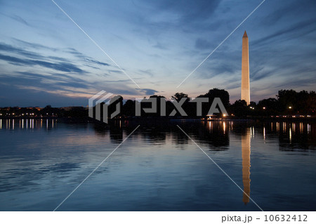 USA, Washington DC, Washington Monument reflecting in water at dusk 10632412