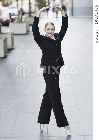 Businesswoman dancing in urban setting Businesswoman dancing in urban setting 10632455