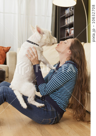 Woman kissing her dog Woman kissing her dog 10632708