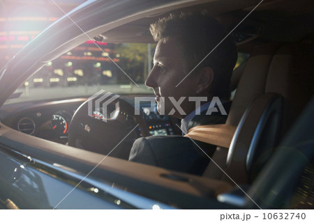 Businessman driving car 10632740