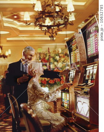 Senior couple in casino playing on slot machines, Las Vegas, Nevada, USA 10632785
