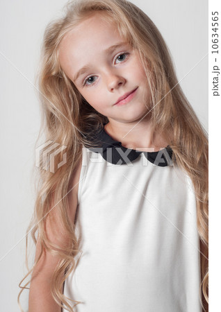 Little cute girl in white dress 10634565